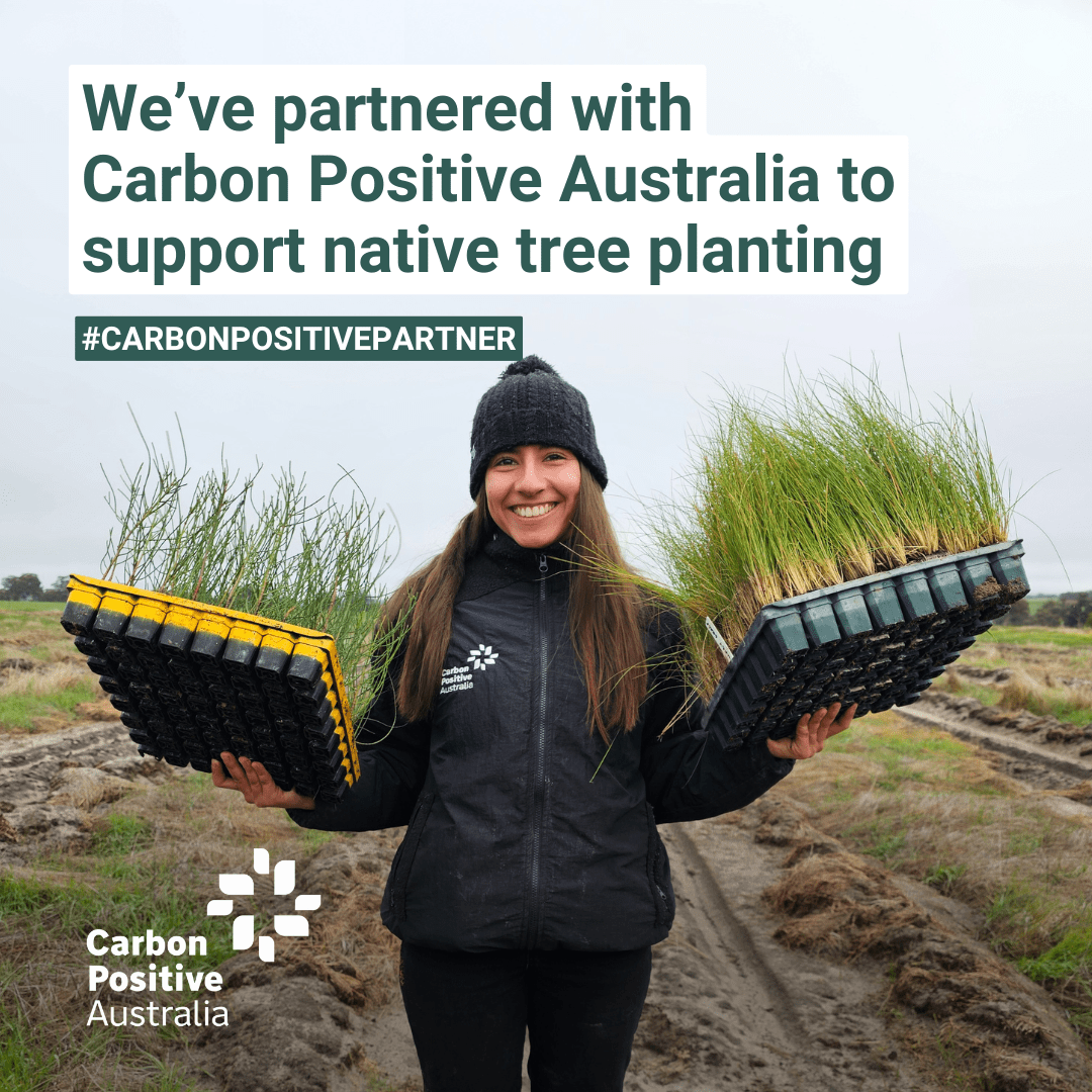 Carbon-Positive-Australia-Plant-Biodiversity A Tr1f3cta team member or partner holding native seedlings, showcasing our partnership with Carbon Positive Australia to support native tree planting.